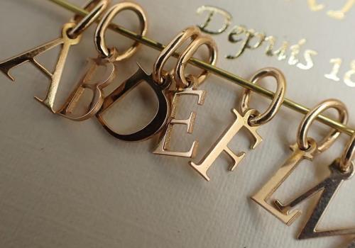 Cutted gold letters Fournier